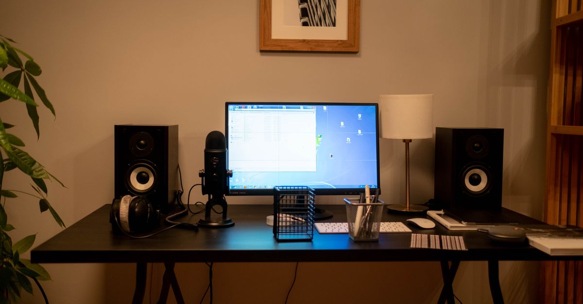 A well-organized modern home office desktop setup featuring technology essentials and accessories.